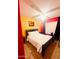 Bright bedroom with a black frame bed, fresh linens, and unique accent wall at 15897 N Gil Balcome St, Surprise, AZ 85374