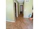 View of a hallway with a neutral color palette and tile flooring at 15897 N Gil Balcome St, Surprise, AZ 85374