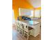 Eat-in kitchen with white cabinetry, a center island and wood-look floors at 15897 N Gil Balcome St, Surprise, AZ 85374