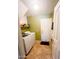 Well-organized laundry room with modern appliances and convenient shelving at 15897 N Gil Balcome St, Surprise, AZ 85374