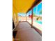 View of the covered patio leading to a refreshing pool and vibrant landscaping at 15897 N Gil Balcome St, Surprise, AZ 85374