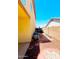 A narrow side yard featuring a gravel bed between the property wall and neighboring home at 15897 N Gil Balcome St, Surprise, AZ 85374