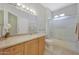 Bathroom features a granite vanity and a combined shower and tub at 16313 W Escondido Ct, Surprise, AZ 85374