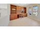Well-lit home office featuring custom built-in cabinetry and a comfortable workspace at 16313 W Escondido Ct, Surprise, AZ 85374
