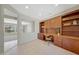 Bright home office with custom built-ins, tile floors, and a functional layout at 16313 W Escondido Ct, Surprise, AZ 85374