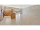 Bright, open kitchen with stainless appliances flows into a large living space with sliding glass doors at 16313 W Escondido Ct, Surprise, AZ 85374
