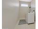 Bright and clean laundry room with a tile floor, washer, and dryer at 16313 W Escondido Ct, Surprise, AZ 85374