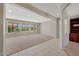 Bright living room featuring large windows with views of the landscaped exterior at 16313 W Escondido Ct, Surprise, AZ 85374
