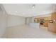 Open living space features kitchen and island, tile floors and recessed lighting at 16313 W Escondido Ct, Surprise, AZ 85374
