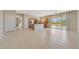 Open living area features a kitchen with an island and sliding door access to the backyard at 16313 W Escondido Ct, Surprise, AZ 85374