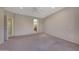 Large main bedroom with neutral walls, plush carpeting, and an en-suite bathroom at 16313 W Escondido Ct, Surprise, AZ 85374