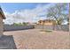 Large backyard features gravel landscaping, a small patch of artificial turf, and block fencing at 1652 E Judi St, Casa Grande, AZ 85122