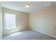 Bedroom with neutral paint, carpet, and a large window allowing natural light to fill the room at 1652 E Judi St, Casa Grande, AZ 85122