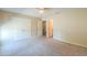 Bedroom with carpeted floors, two double door closets and a door leading to another room at 1652 E Judi St, Casa Grande, AZ 85122