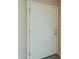 A white painted door featuring recessed panels and a brushed metal handle against a neutral wall at 1652 E Judi St, Casa Grande, AZ 85122