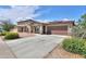 An inviting single-Gathering home boasting a desert landscape, two-car garage, and tile roof at 1652 E Judi St, Casa Grande, AZ 85122