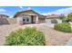 Single-Gathering home showcasing desert landscaping, a tile roof, and a well-maintained front yard at 1652 E Judi St, Casa Grande, AZ 85122