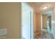 An inviting hallway with neutral walls and wood look tile, connecting various rooms in the house at 1652 E Judi St, Casa Grande, AZ 85122