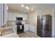 Modern kitchen features stainless steel appliances, granite countertops, and bright white cabinetry at 1652 E Judi St, Casa Grande, AZ 85122
