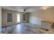 Open living area featuring stylish gray flooring, a back door, and mini kitchen island at 1652 E Judi St, Casa Grande, AZ 85122