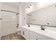 Modern bathroom with double sink vanity, subway tile, and dark fixtures at 18174 W Ashley Dr, Goodyear, AZ 85338