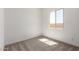 Bedroom featuring a window showing exterior light and neutral carpet at 18174 W Ashley Dr, Goodyear, AZ 85338