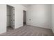 Inviting bedroom with closet and ensuite bath, featuring neutral carpeting and abundant light at 18174 W Ashley Dr, Goodyear, AZ 85338
