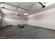 Spacious garage with overhead door and ample room for parking and storage at 18174 W Ashley Dr, Goodyear, AZ 85338