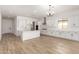 Bright, open-concept kitchen and living area with an island, and stainless steel appliances at 18174 W Ashley Dr, Goodyear, AZ 85338