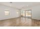 Bright living room with tile flooring and sliding glass doors to patio at 18174 W Ashley Dr, Goodyear, AZ 85338