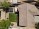 Aerial view of backyard featuring artificial grass, mature trees and ample space for outdoor living at 18390 W Hayden Dr, Surprise, AZ 85374