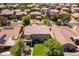 Backyard featuring artificial grass, mature trees, outdoor seating area and ample room for entertaining at 18390 W Hayden Dr, Surprise, AZ 85374