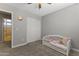 Bedroom features a daybed, ceiling fan, and closet at 18390 W Hayden Dr, Surprise, AZ 85374