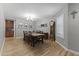Dining room featuring wood floors and a traditional table with seating for eight at 18390 W Hayden Dr, Surprise, AZ 85374