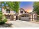 Beautiful home exterior showcasing a well-manicured lawn, a spacious driveway and an attached three-car garage at 18390 W Hayden Dr, Surprise, AZ 85374