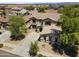 Two-story home featuring desert landscaping with a spacious driveway and a two-car garage at 18390 W Hayden Dr, Surprise, AZ 85374