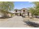 Charming two-story home featuring a well-maintained front yard and an inviting driveway at 18390 W Hayden Dr, Surprise, AZ 85374