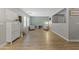 Versatile flex space with wood floors, seating area and ample storage solutions at 18390 W Hayden Dr, Surprise, AZ 85374