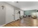 Versatile flex space featuring wood floors, a coat rack, and plenty of natural light at 18390 W Hayden Dr, Surprise, AZ 85374