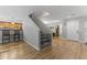 Inviting living space featuring wood floors and staircase with safety gate at 18390 W Hayden Dr, Surprise, AZ 85374