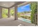 A covered balcony overlooking a sparkling pool and lush greenery offers serene outdoor living at 1951 W Bartlett Ct, Chandler, AZ 85248