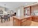 Beautiful kitchen island with granite countertops and views of the living area at 1951 W Bartlett Ct, Chandler, AZ 85248