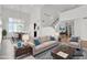 Bright, open-concept living room with a dining area, staircase, and modern furnishings at 1951 W Bartlett Ct, Chandler, AZ 85248