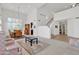 Spacious living area featuring high ceilings and access to the staircase at 1951 W Bartlett Ct, Chandler, AZ 85248