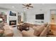 Cozy living room with a fireplace, hardwood floors, and comfortable seating at 1951 W Bartlett Ct, Chandler, AZ 85248