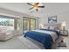 Staged main bedroom with a sliding glass door and plenty of natural light at 1951 W Bartlett Ct, Chandler, AZ 85248