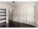 Bedroom with closet and shelving unit and dark wood floors at 2026 E Cortez Dr, Gilbert, AZ 85234