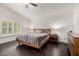 Main bedroom with a vaulted ceiling, hardwood floors, and plantation shutters for lots of natural light at 2026 E Cortez Dr, Gilbert, AZ 85234