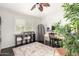 Office/bedroom featuring hardwood floors, plantation shutters, and a dedicated desk at 2026 E Cortez Dr, Gilbert, AZ 85234