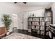 Versatile room featuring hardwood floors and a built-in shelving unit at 2026 E Cortez Dr, Gilbert, AZ 85234